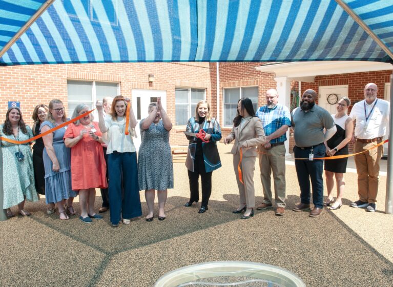 Malcolm Cole Childcare Center (MCCCC) team and UVA Health Facilities Management and Leadership cut the ribbon at new MCCCC Playground