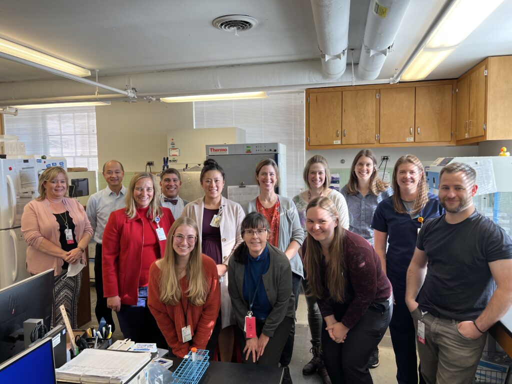 Chief Executive Officer Wendy Horton, PharmD, MBA, FACHE with one of UVA Health's lab teams